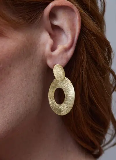 Close up of red haired model wearing 22ct Gold Vermeil Big O Drop Earrings